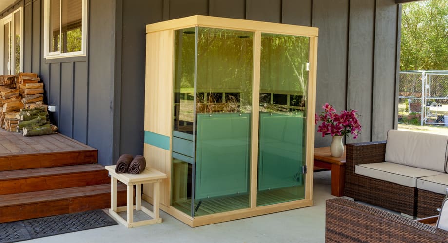 3 Person Evolve 30 Infrared Sauna on Patio Evolve 30 3 Person Infrared Sauna placed under a patio cover for outdoor home wellness and relaxation.