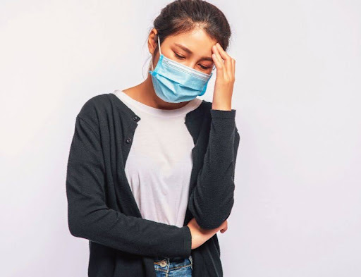 A woman contemplating an IR sauna session to benefit from its immune system-boosting capabilities.