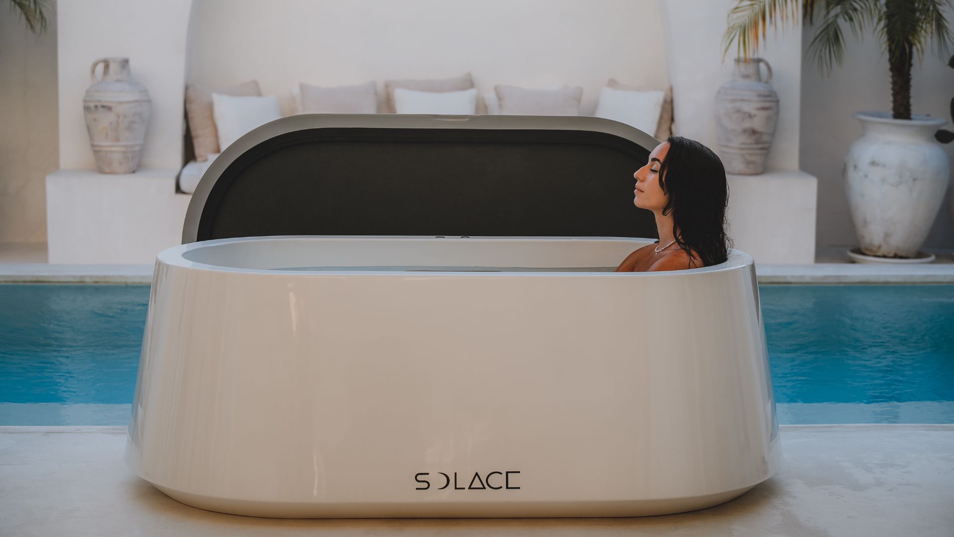 Woman boosts circulation post-workout with a Solace Ice Bath